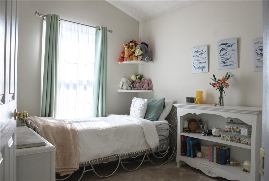 840 Camelon Court Alpharetta, GA 30004 - Photo 17 of 25 a bedroom with a bed and a window