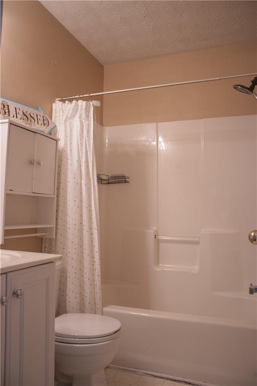840 Camelon Court Alpharetta, GA 30004 - Photo 21 of 25 a bathroom with a shower a toilet and sink