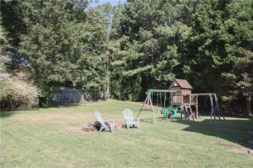 840 Camelon Court Alpharetta, GA 30004 - Photo 3 of 25 a view of a house with backyard porch and sitting area
