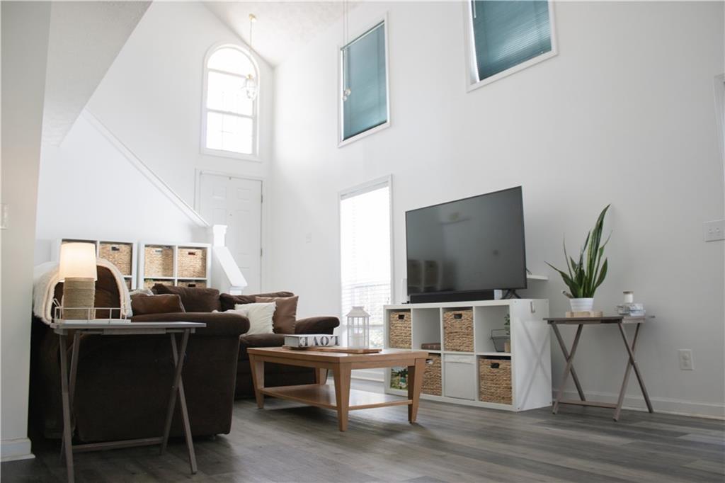 840 Camelon Court Alpharetta, GA 30004 - Photo 6 of 25 a work room with furniture and wooden floor