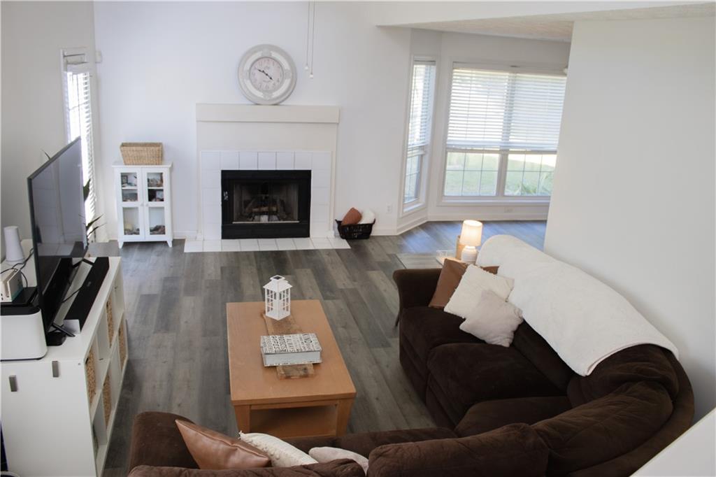 840 Camelon Court Alpharetta, GA 30004 - Photo 9 of 25 a living room with furniture and a fireplace