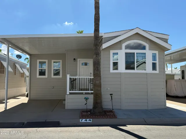 a front view of a house with wooden fence