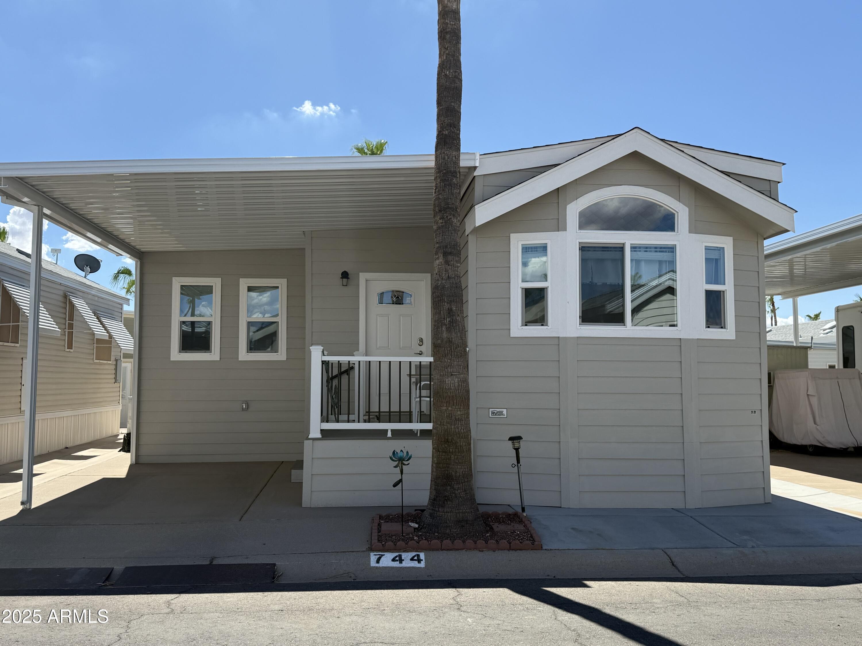 a front view of a house with wooden fence