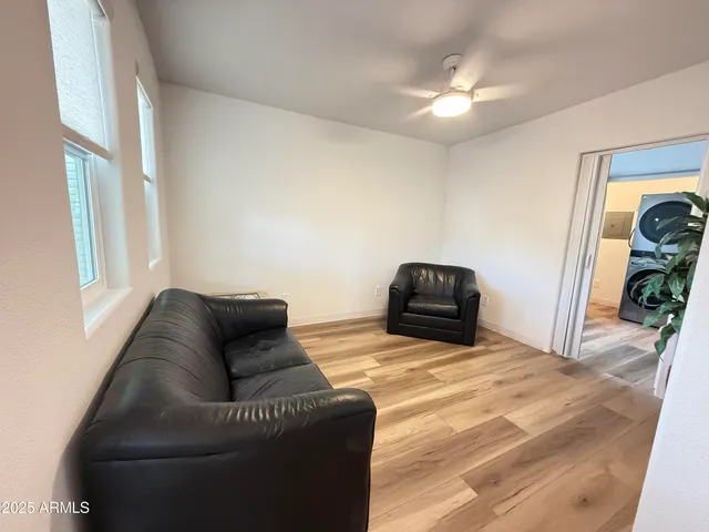 a bedroom with furniture and a window