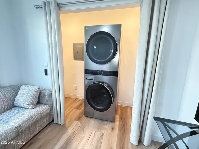 a living room with furniture and a mirror