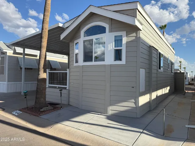 a view of front door and potted plants