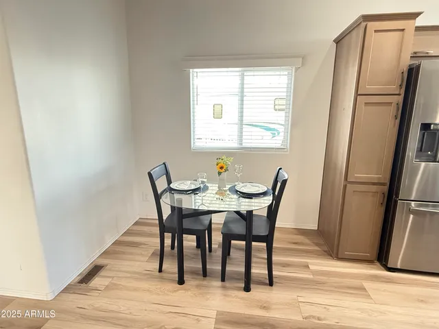 a view of a dining room with furniture window and wooden floor