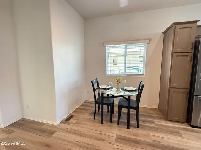 a view of a dining room with furniture window and wooden floor