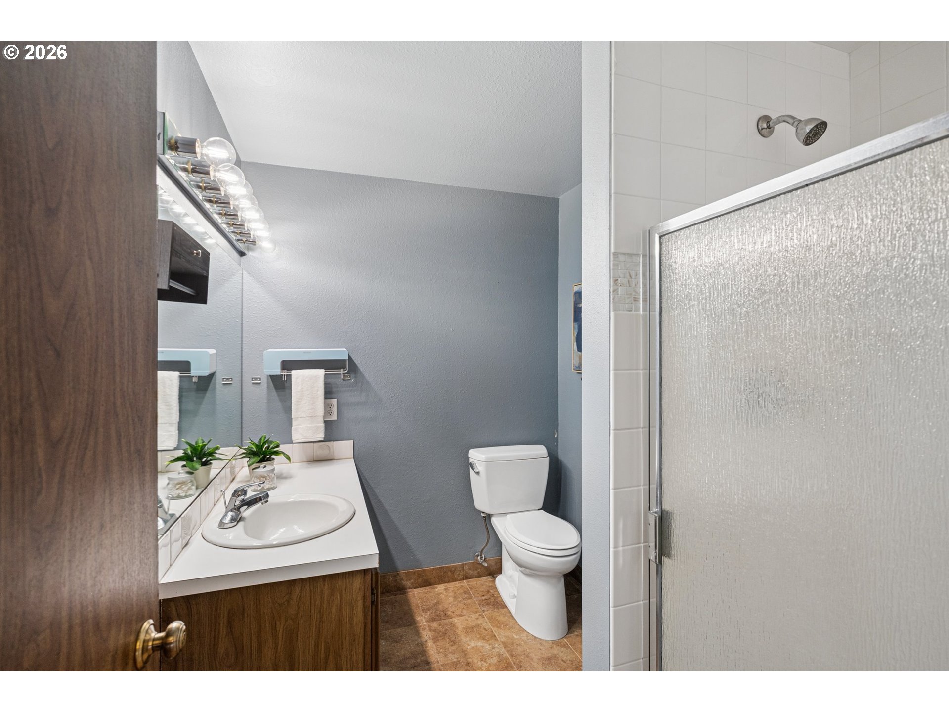 255 West Berkeley Street Gladstone, OR 97027 - Photo 22 of 37 a bathroom with a sink a toilet and a mirror