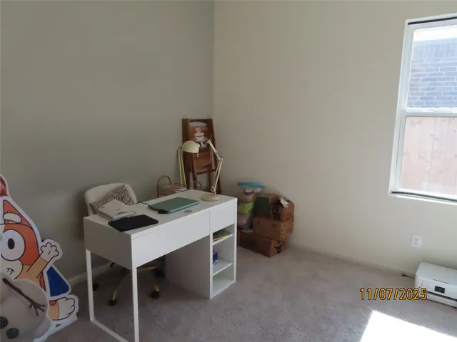 a workspace with furniture and window