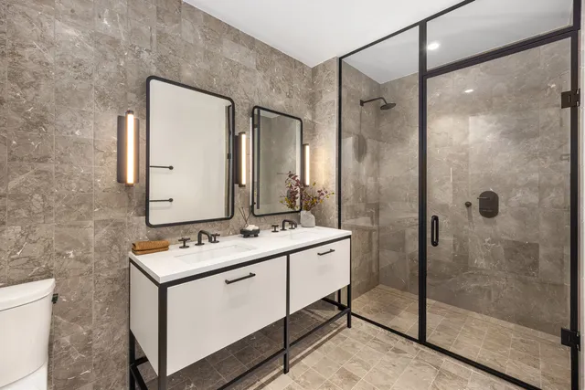 a spacious bedroom with a large bed and a large window