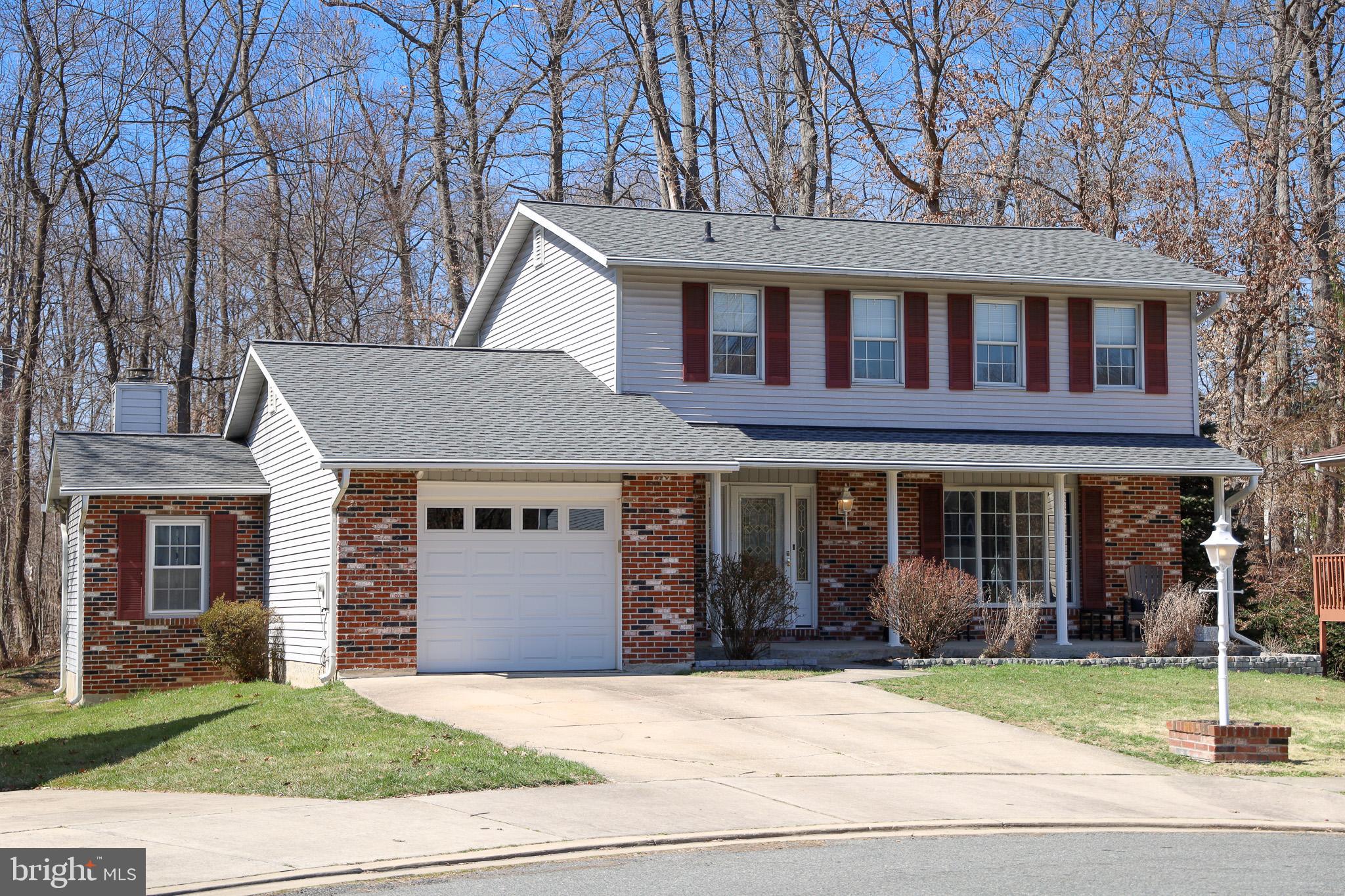 4402 Macworth Place Nottingham, MD 21236 - Photo 1 of 36 a front view of a house with a yard and garage