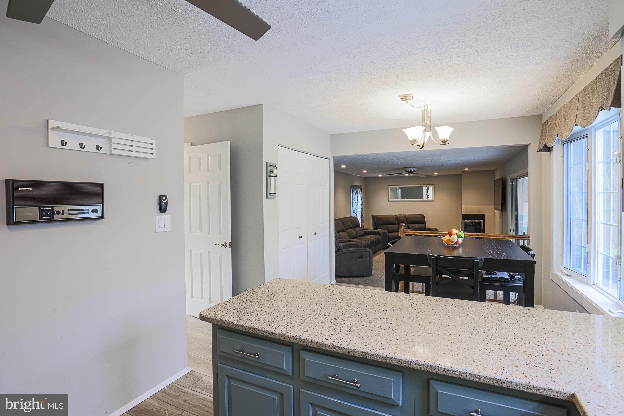 4402 Macworth Place Nottingham, MD 21236 - Photo 11 of 36 a kitchen with kitchen island a counter top space and stainless steel appliances