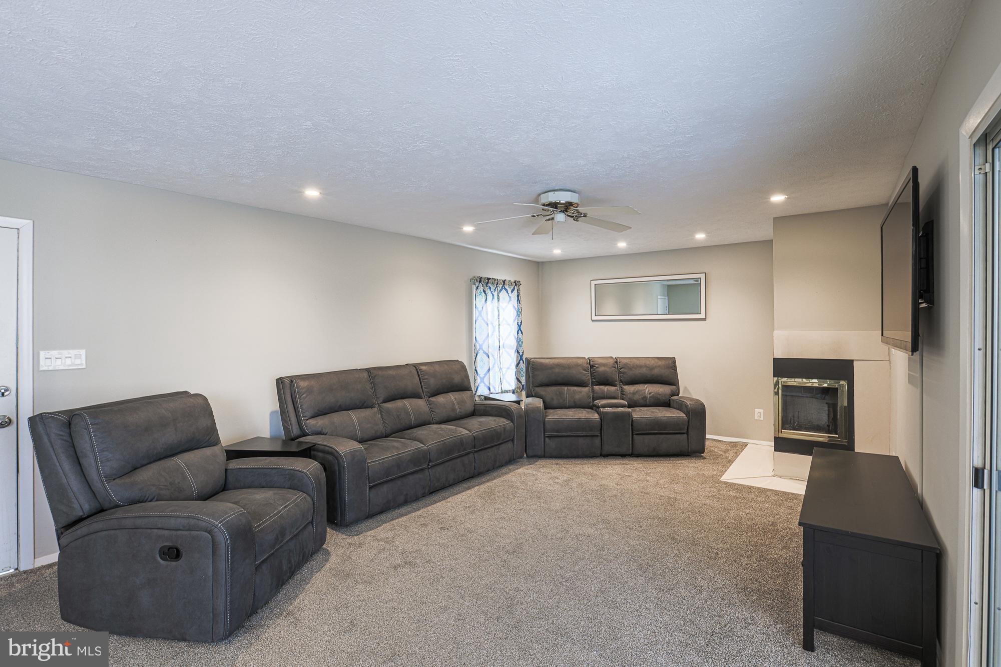 4402 Macworth Place Nottingham, MD 21236 - Photo 13 of 36 a living room with furniture and a fireplace