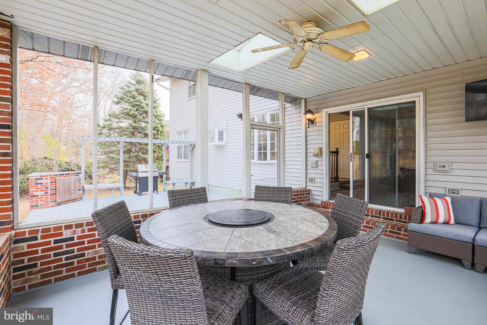 4402 Macworth Place Nottingham, MD 21236 - Photo 16 of 36 a dining room with furniture and a floor to ceiling window