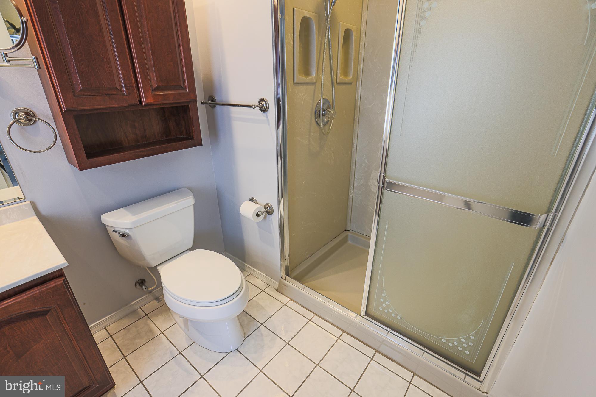 4402 Macworth Place Nottingham, MD 21236 - Photo 21 of 36 a bathroom with a toilet and a shower