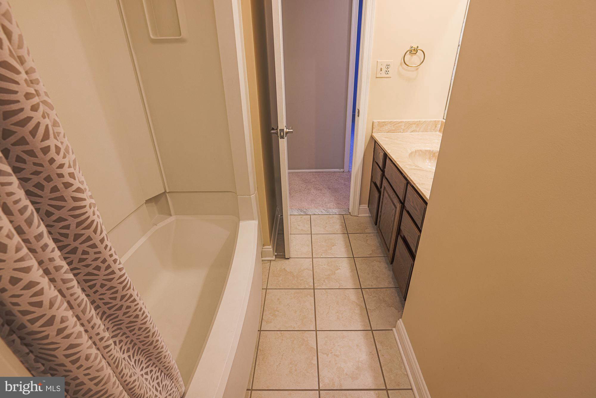 4402 Macworth Place Nottingham, MD 21236 - Photo 27 of 36 a bathroom with a bathtub