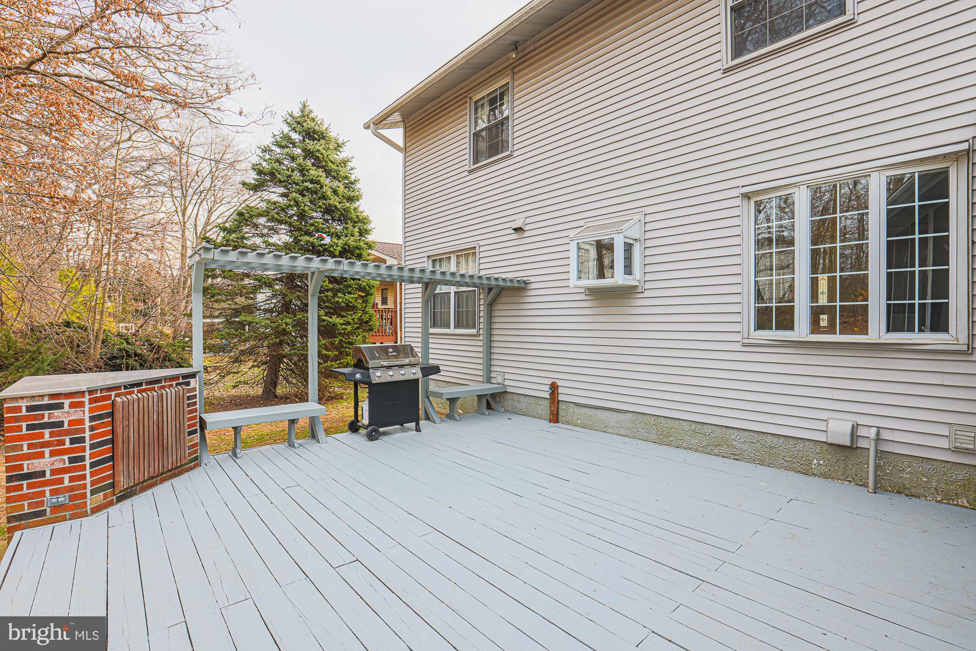 4402 Macworth Place Nottingham, MD 21236 - Photo 32 of 36 a view of a deck with wooden floor and barbeque oven