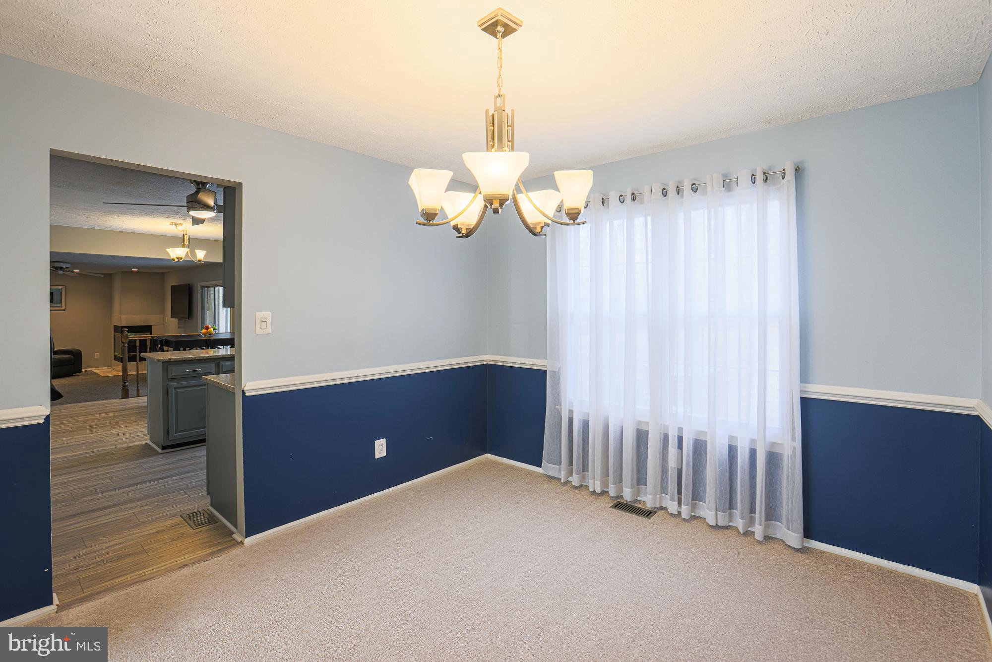 4402 Macworth Place Nottingham, MD 21236 - Photo 6 of 36 a view of kitchen with granite countertop cabinets and wooden floor