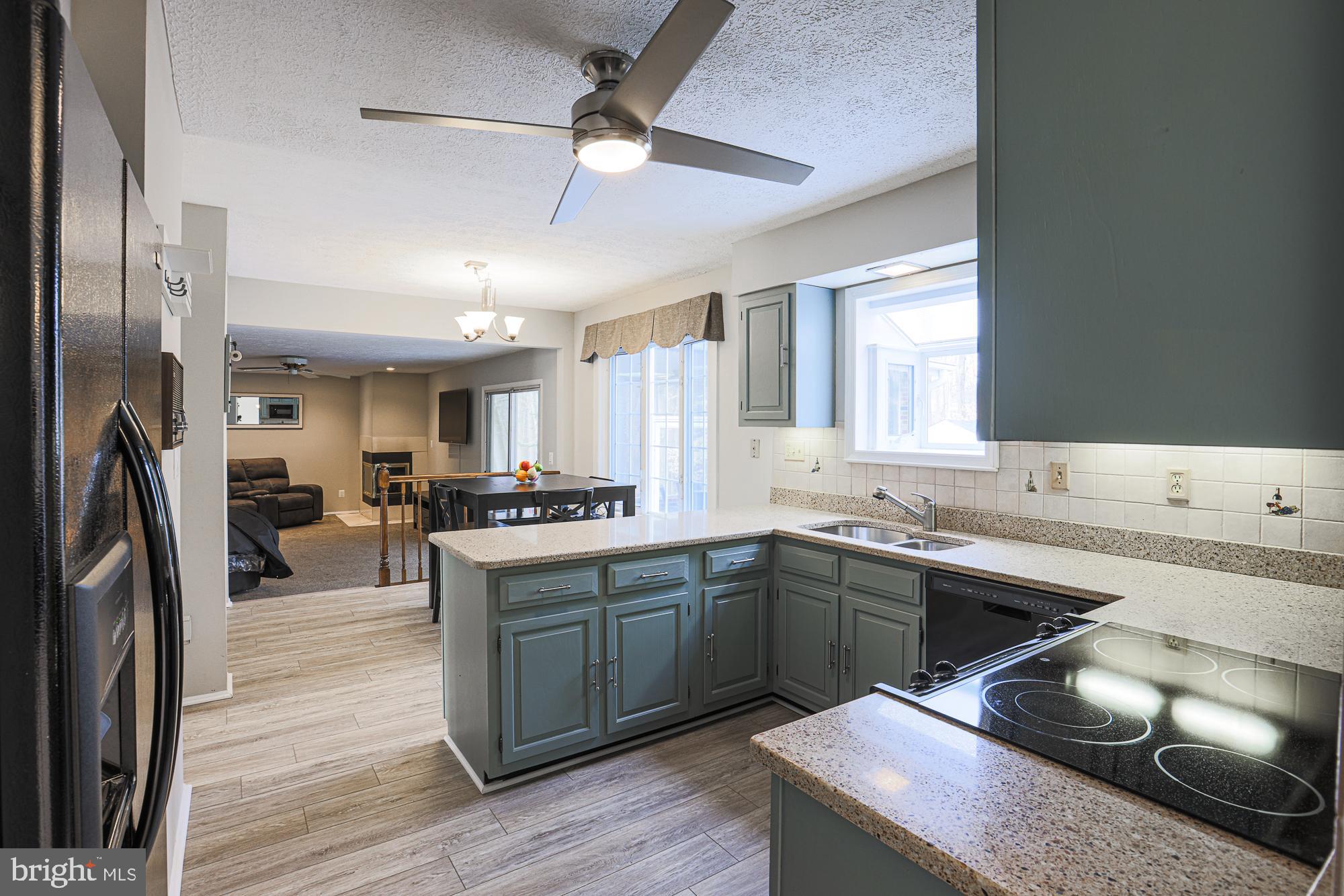 4402 Macworth Place Nottingham, MD 21236 - Photo 9 of 36 a kitchen with stainless steel appliances granite countertop a sink stove and refrigerator