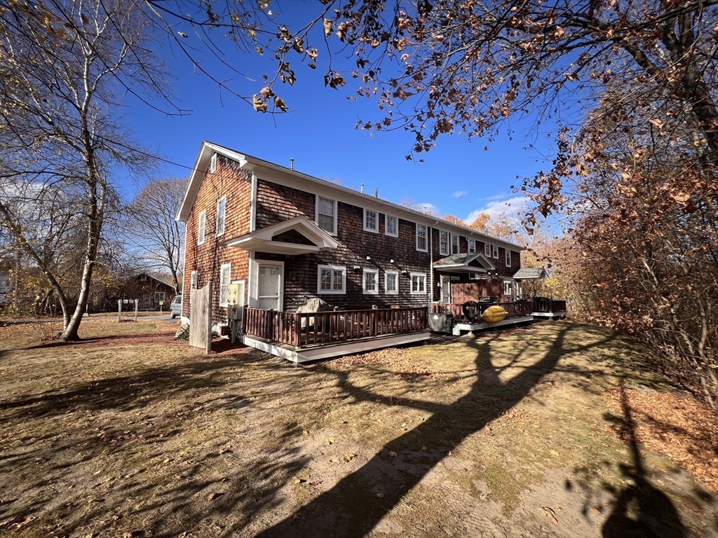 230 Beacon Street, Unit 3 Clinton, MA 01510 - Photo 13 of 13 a view of a patio with a table and chairs