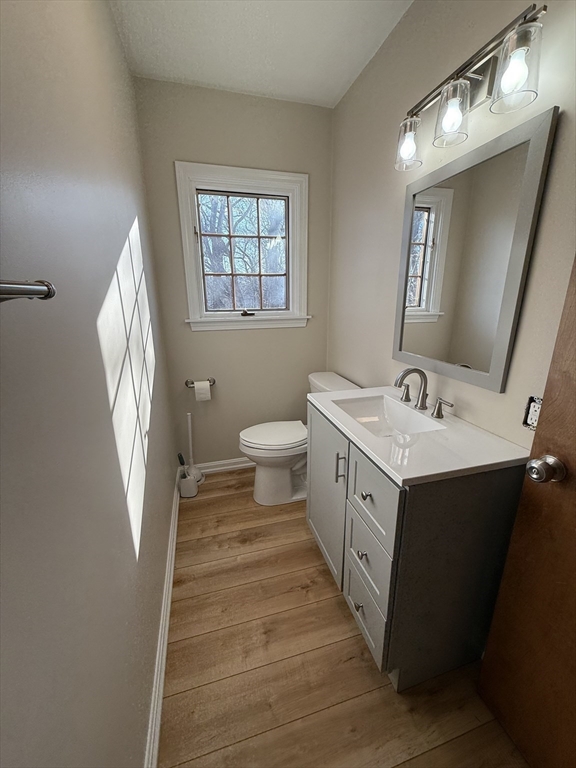 230 Beacon Street, Unit 3 Clinton, MA 01510 - Photo 7 of 13 a spacious bathroom with a sink a toilet and a mirror