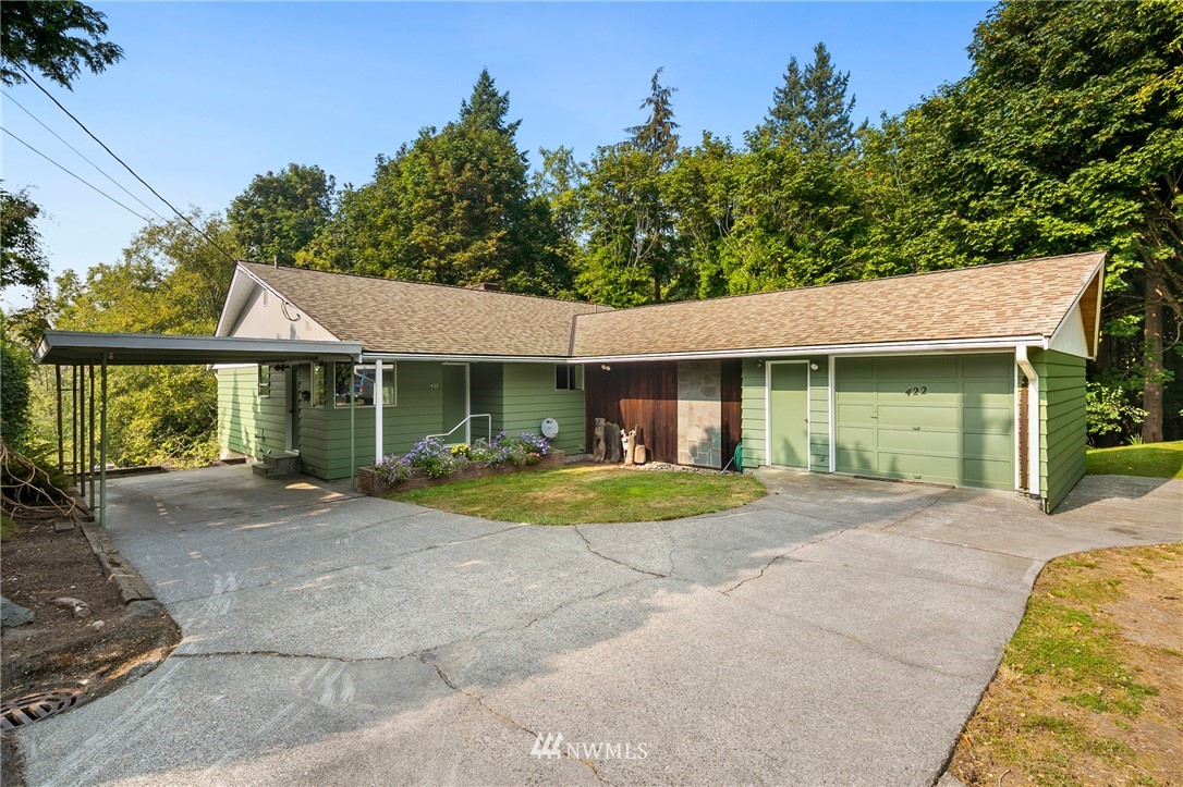 422 Center Place Everett, WA 98203 - Photo 1 of 34 a front view of a house with a yard and porch