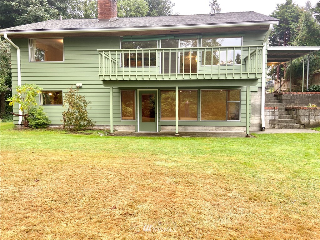 422 Center Place Everett, WA 98203 - Photo 5 of 34 a front view of a house with a yard