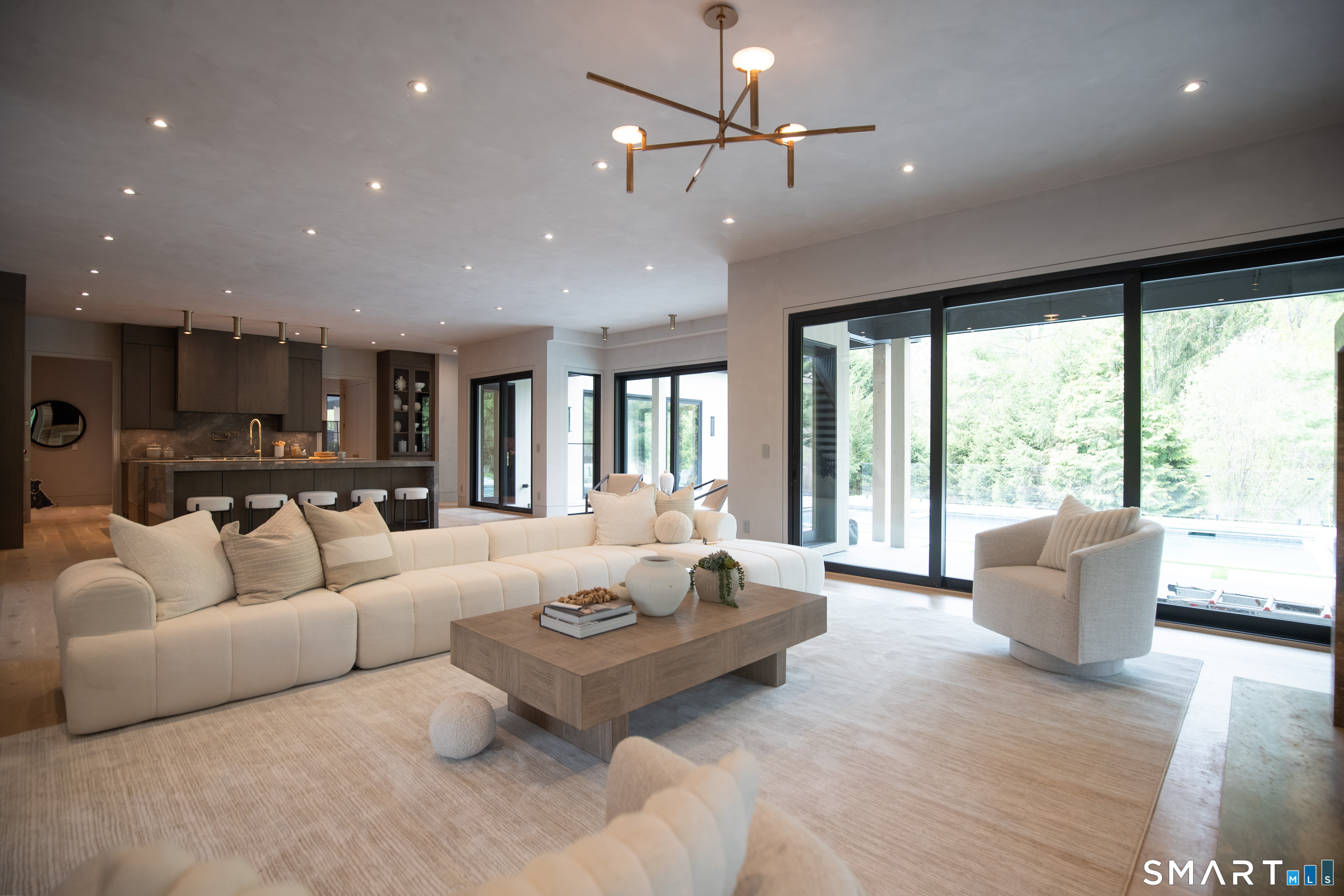 259 Frogtown Road New Canaan, CT 06840 - Photo 11 of 39 Family room with slider to pool area
