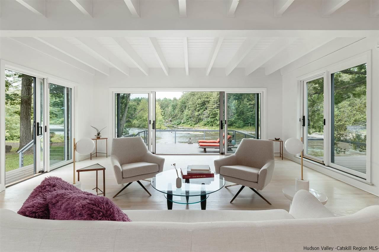 172 Crystal Point Road Cairo, NY 12431 - Photo 17 of 35 a living room with furniture and a large window
