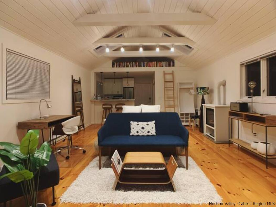 172 Crystal Point Road Cairo, NY 12431 - Photo 21 of 35 a living room with furniture and a flat screen tv