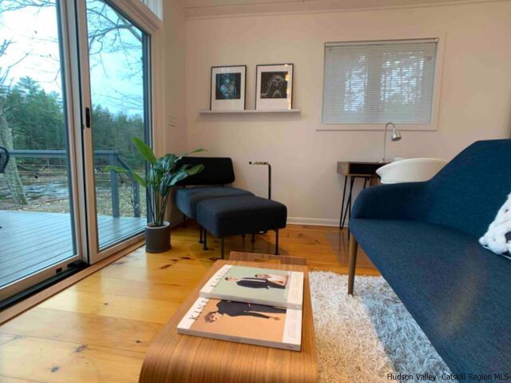 172 Crystal Point Road Cairo, NY 12431 - Photo 23 of 35 a living room with furniture and a large window