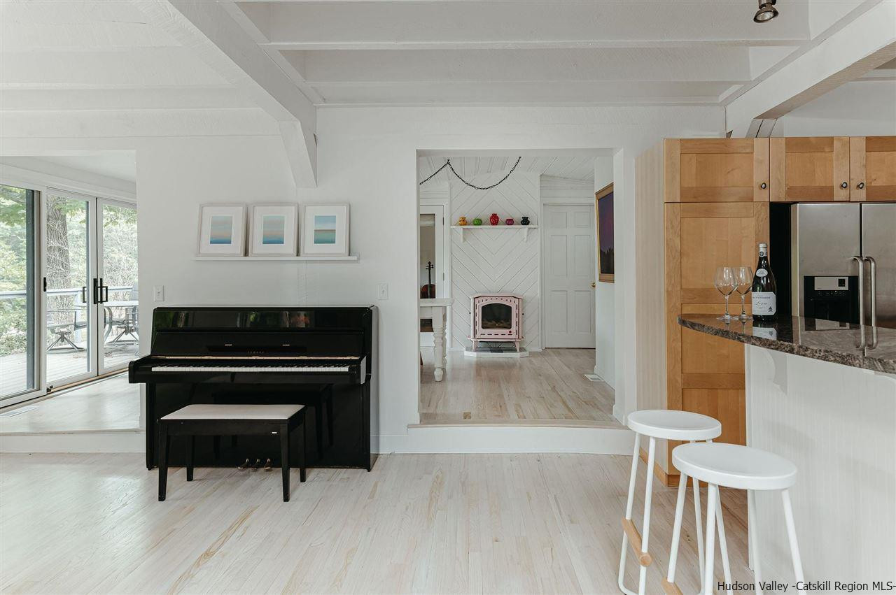 172 Crystal Point Road Cairo, NY 12431 - Photo 7 of 35 a living room with furniture and a fireplace