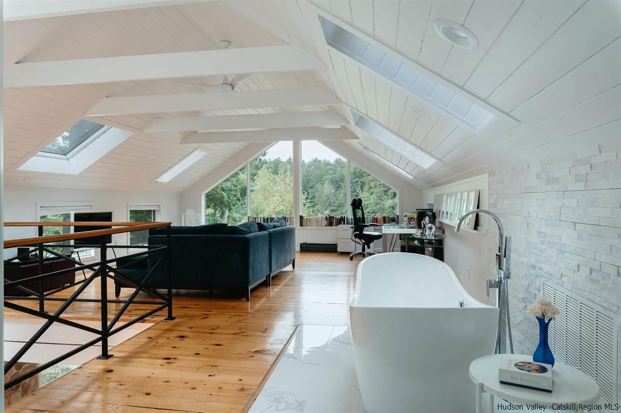 172 Crystal Point Road Cairo, NY 12431 - Photo 10 of 35 a living room with furniture and a fireplace