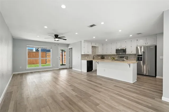 a view of swimming pool with a backyard