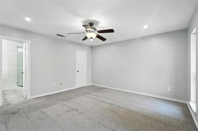 a kitchen with a sink a stove and cabinets