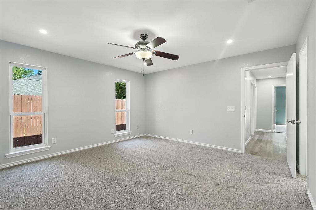 1402 Country Lane Allen, TX 75002 - Photo 18 of 39 Empty room featuring light colored carpet, recessed lighting, and ceiling fan