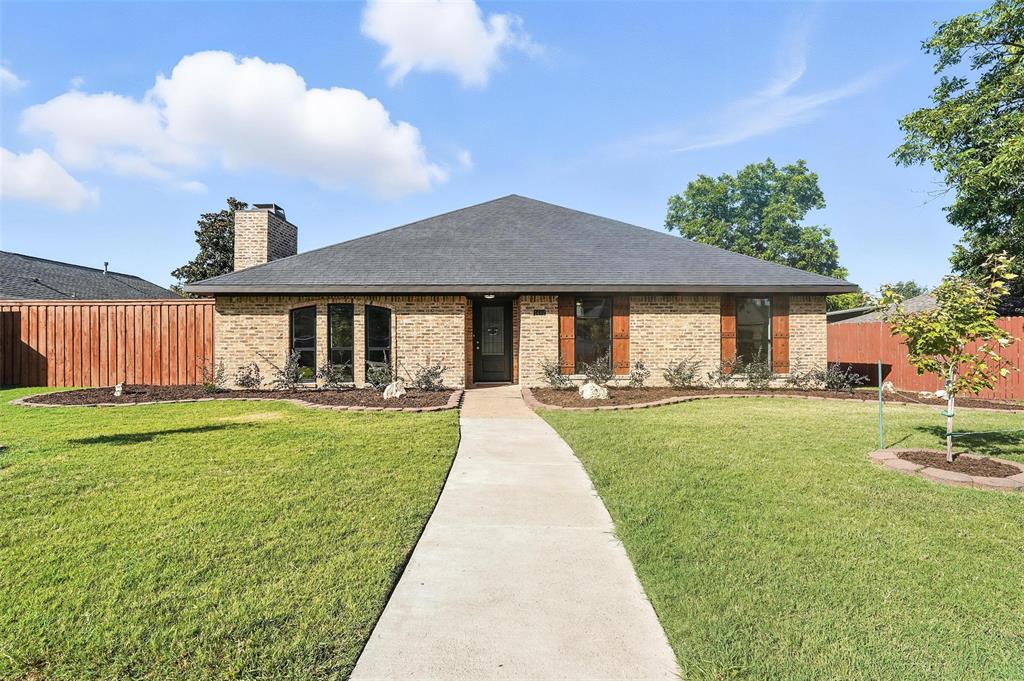 1402 Country Lane Allen, TX 75002 - Photo 2 of 39 View of front of home with brick siding, roof with shingles, and a chimney
