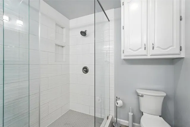 a bathroom with a double sink shower and a mirror