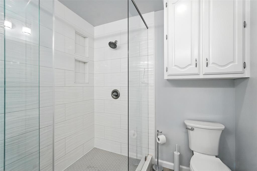 1402 Country Lane Allen, TX 75002 - Photo 21 of 39 Bathroom featuring a shower stall