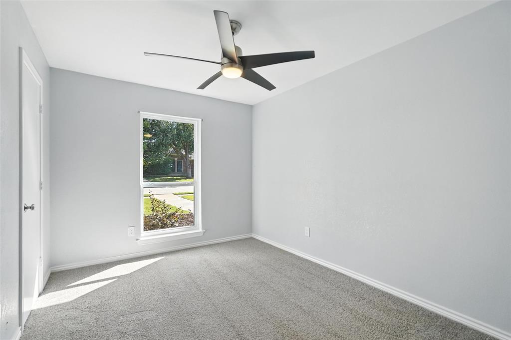 1402 Country Lane Allen, TX 75002 - Photo 25 of 39 Carpeted spare room with ceiling fan and baseboards