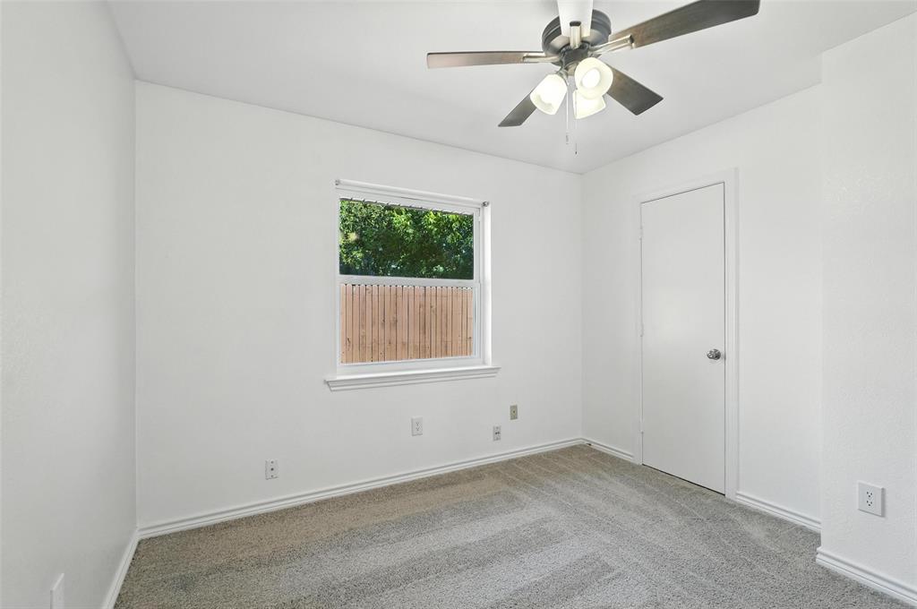 1402 Country Lane Allen, TX 75002 - Photo 28 of 39 Empty room with light colored carpet and ceiling fan