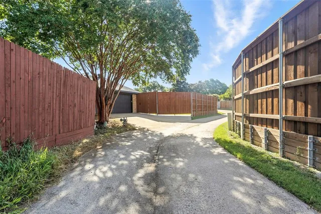 a view of a house with backyard and porch
