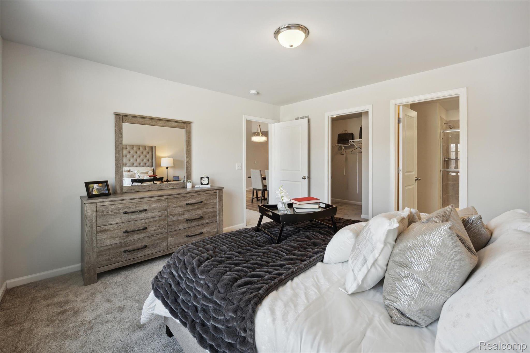 9917 Ridge Run Street, Unit 93 Howell, MI 48855 - Photo 8 of 21 Primary En Suite Bedroom on Entry Level