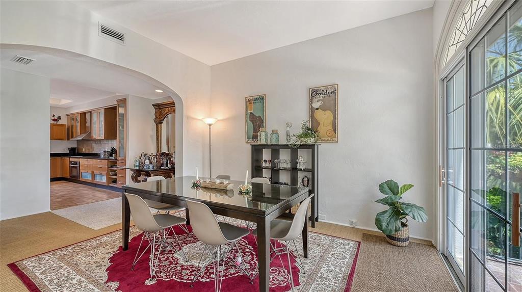 33 Bishopscourt Road, Unit 118 Osprey, FL 34229 - Photo 14 of 69 a living room with furniture and wooden floor