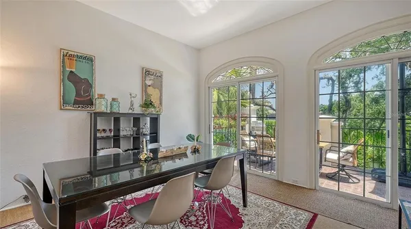 a kitchen with stainless steel appliances granite countertop a refrigerator and a stove