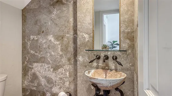 a bathroom with a sink and a mirror