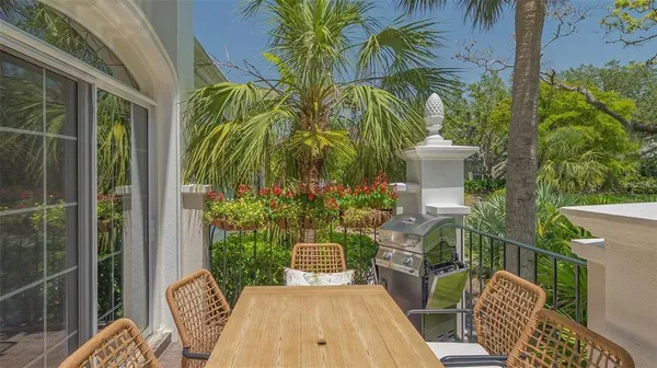 a swimming pool with outdoor seating and yard