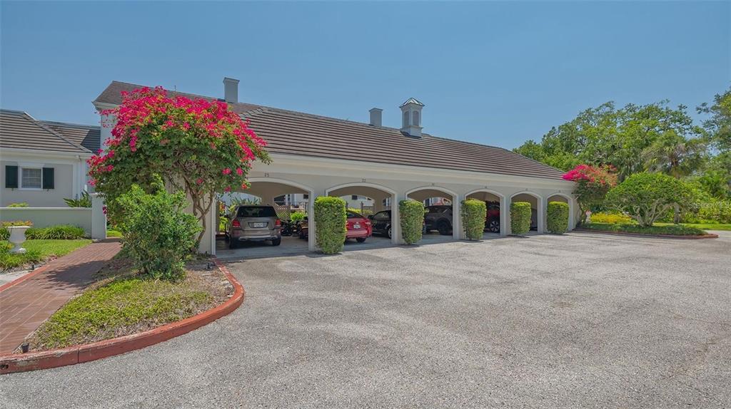 33 Bishopscourt Road, Unit 118 Osprey, FL 34229 - Photo 40 of 69 a front view of a house with garden