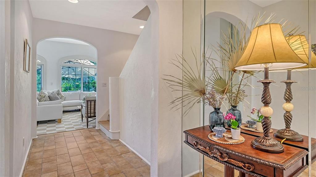 33 Bishopscourt Road, Unit 118 Osprey, FL 34229 - Photo 6 of 69 a living room with furniture and a table